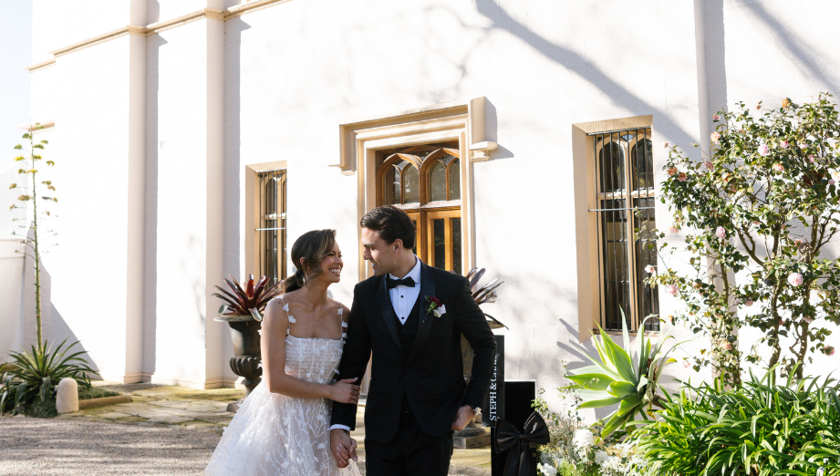 A couple celebrating their wedding at a harbourside heritage mansion, Lindesay.