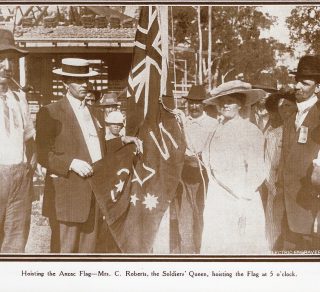 The Soldier's Queen hoists the flag at ANZAC Cottage on February 12, 1916