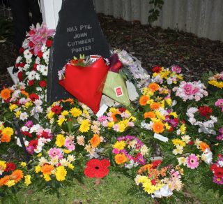 Wreaths laid at Private Porter's memorial stone on ANZAC Day ( from Friends of ANZAC Cottage Collection)