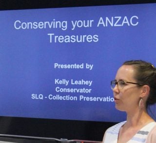 SLQ conservator providing preservation advice