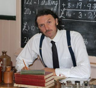 Mr Shaw Paul Rowe at his desk related image
