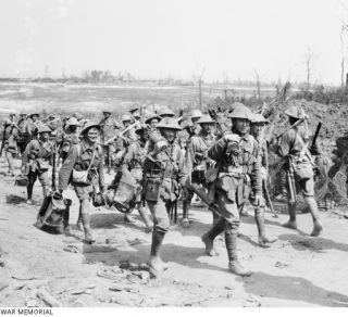 Australian machine gunners returning from the front line trenches to their billets in France 1916 related image