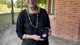 Dr Robyn Taylor with her medal