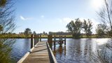 View of the public jetty and vinyards on the far side of the river from Woodbridge