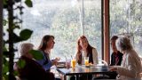 A group of people in the cafe, Riverside at Woodbridge