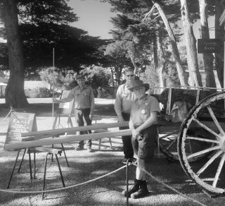A black and white photo showing volunteers who restored the tipping dray in the Amess Barn on Churchill Island related image