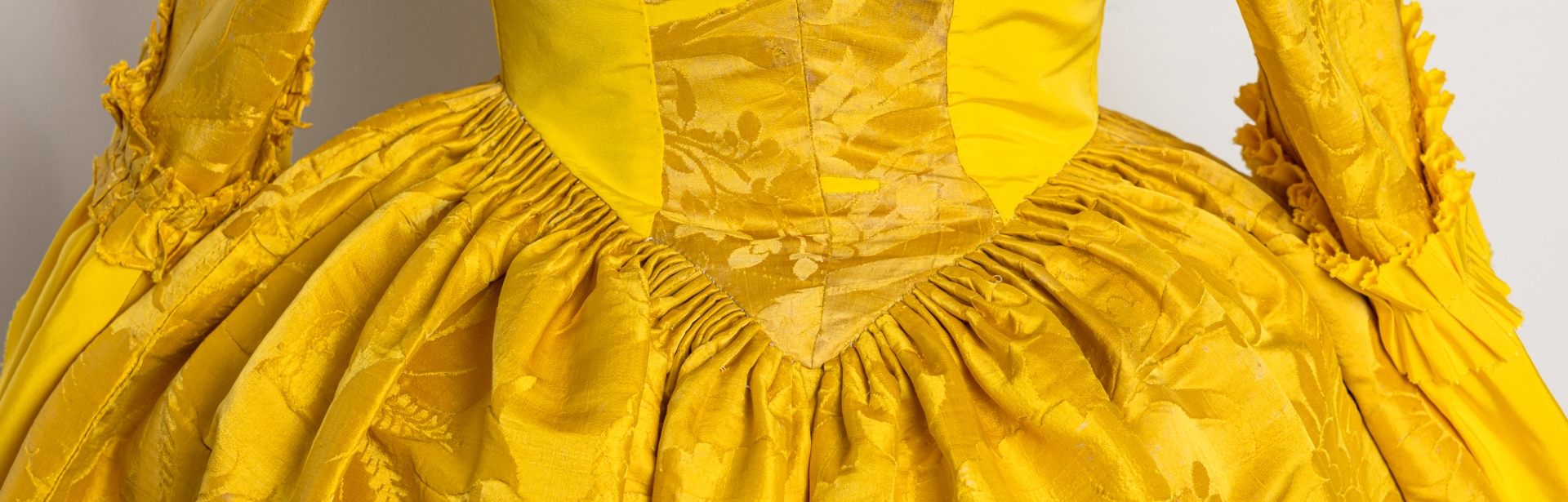 Students piece together the mystery of a 280-year-old yellow dress –  National Trust