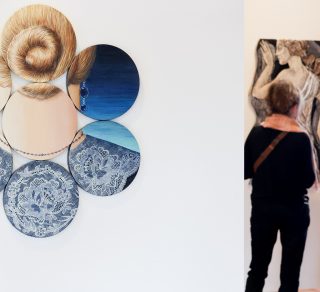 Painting by Deborah Klein called Coil with exhibition visitors in the background related image