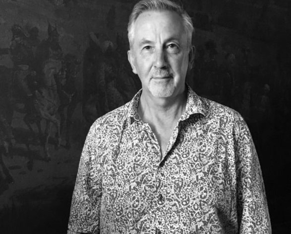 Black and White photograph of Michael McWilliams on a black background  photo from Philip Bacon Galleries