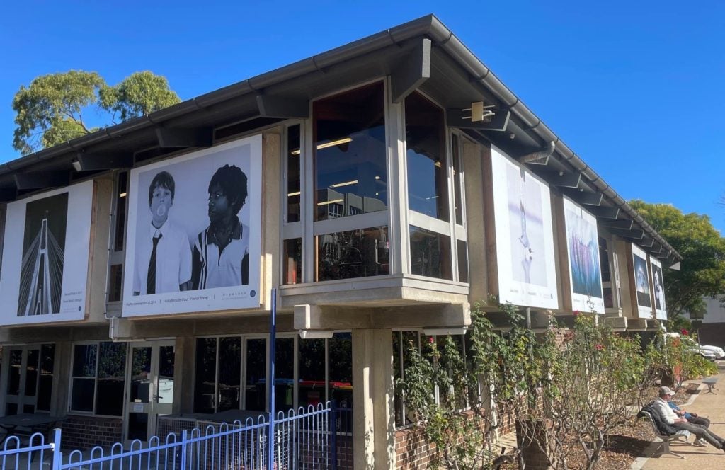 An exterior view of the mid-century Gosford Library looking up towards blue sky.