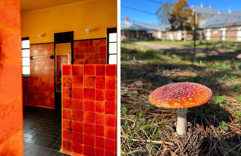 An Art Deco bathroom tiled in red and black tiles, a red mushroom with white spots.