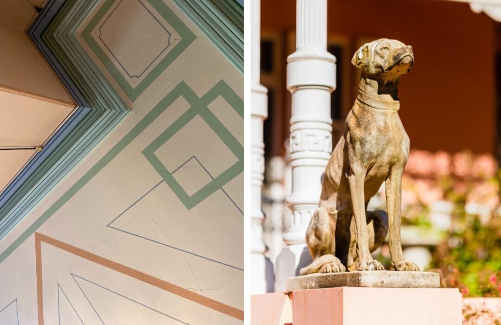 A ceiling painted in geometric designs in chalky hues at Harper's Mansion and a statue of a dog.