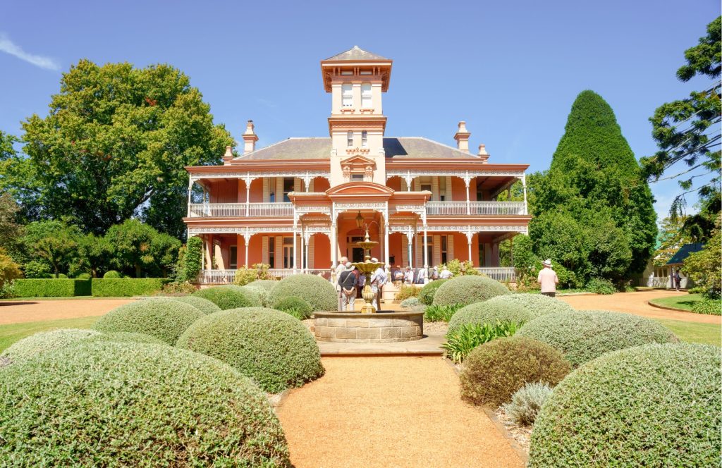 A pink mansion in the afternoon sunshine.