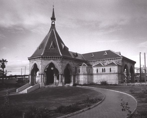 A gothicinspired sandstone building with dramatic arches and ornate detailing
