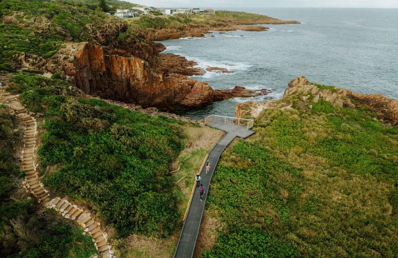 An aerial view of a walk along a cliff-top