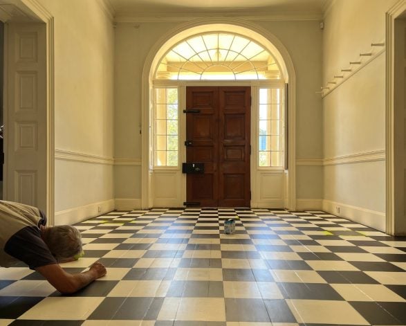 The black and white painted wooden floor of the foyer of Old Government House