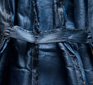 A blue jacket showing the seams