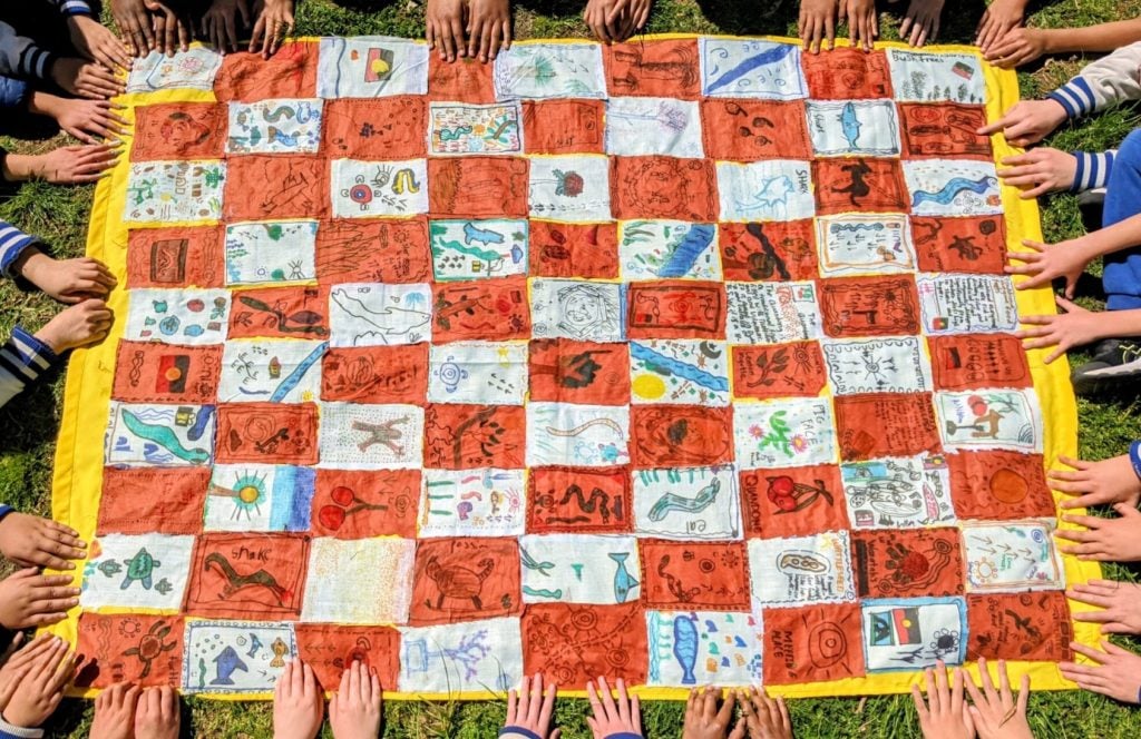 A vibrant patchwork featuring art from Plunkett Street primary school students for the NSW Schools Reconciliation Challenge.