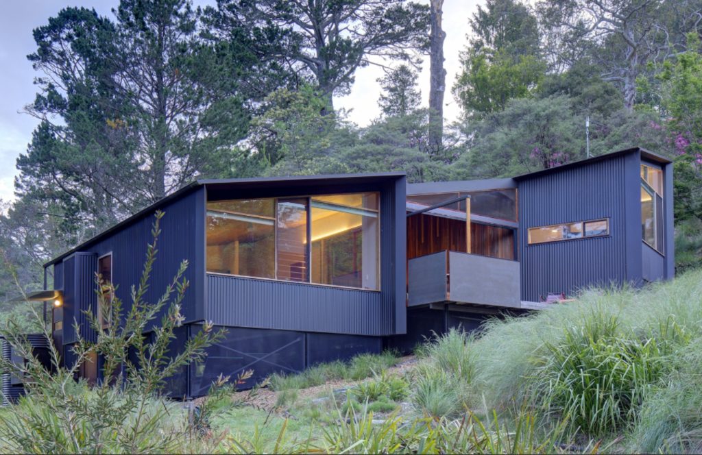 An eco-house constructed from glass and steel set amongst the Blue Mountains