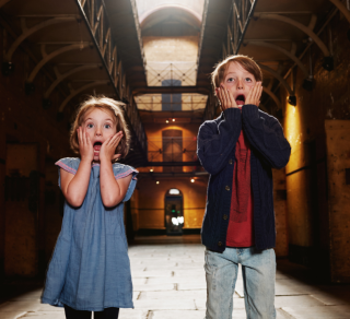 Two kids experiencing Halloween at Old Melbourne Gaol