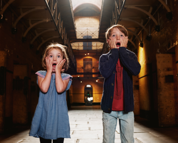 Two kids experiencing Halloween at Old Melbourne Gaol